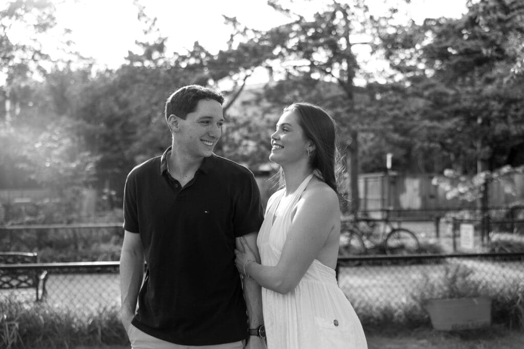 Engaged couple sharing a joyful moment during engagement photos in Virginia.