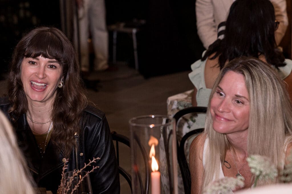 Community dinner atmosphere designed by Chelsea Quenum Wedding Planning & Event Design at Clyde’s Willow Creek Farm.