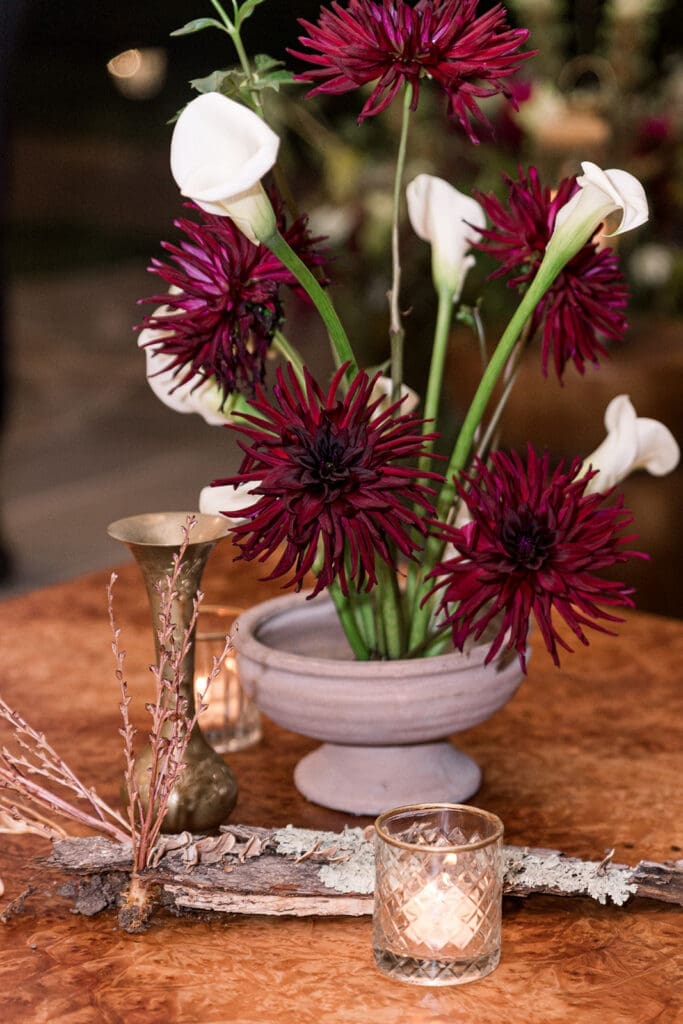 Elevated woodland garden table design with moss, mushrooms, and candlelight at Clyde’s Willow Creek Farm.