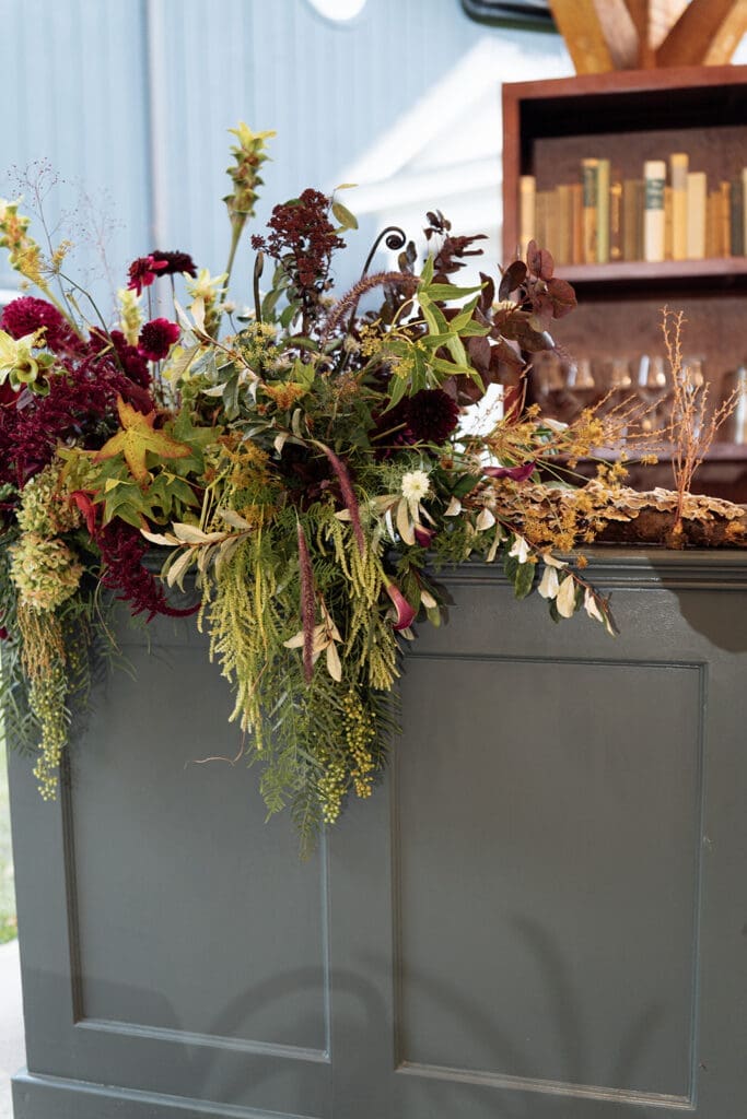 Elevated woodland garden table design with moss, mushrooms, and candlelight at Clyde’s Willow Creek Farm.