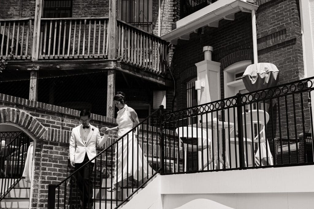 Candid wedding moment at Swann House garden terrace — photo by Morgan Kay Photo