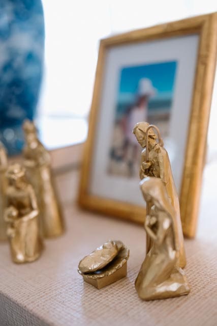 A golden nativity set displayed on our console table, a simple reminder of the sacred beauty at the heart of Advent.