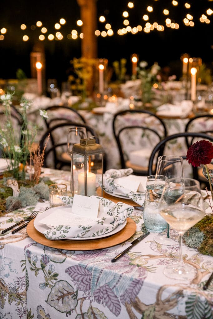 Close-up of a candlelit dinner table with soft florals and glowing tapers, creating an intimate, romantic atmosphere for a Northern Virginia wedding.