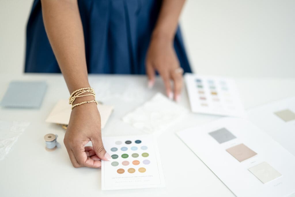 Wedding design blueprint with color palette swatches and materials.